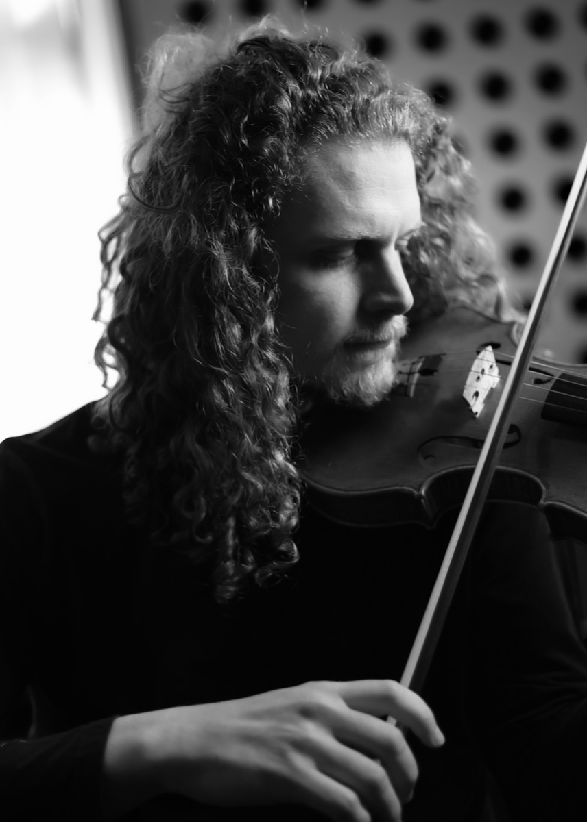 Rob playing violin, black and white